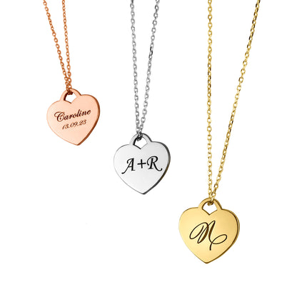 Handcrafted sterling silver heart tag necklace that can be customized with a single initial, double initials or an inscription of your choice.